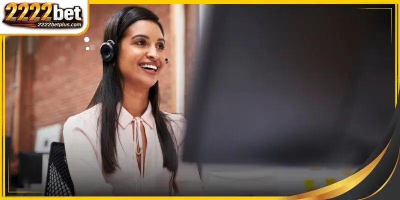 A professional support agent wearing a headset in a modern office